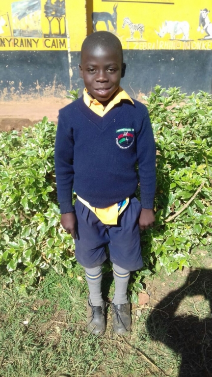 a boy in his Liberty School uniform